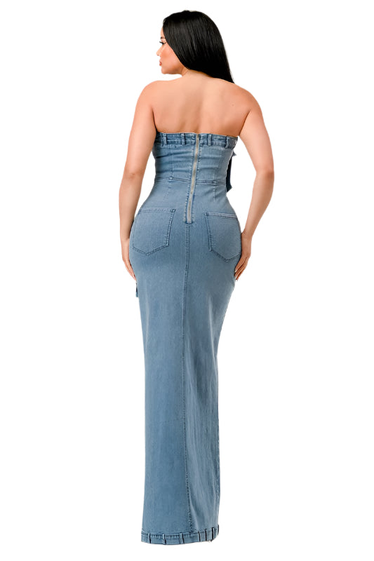 Where edgy streetwear meets evening elegance. This unique piece combines the casual appeal of denim with the sophistication of a formal gown. The garment boasts a strapless bodice with a straight-across neckline, highlighted by a playful ruffle that adds a touch of feminine flair.