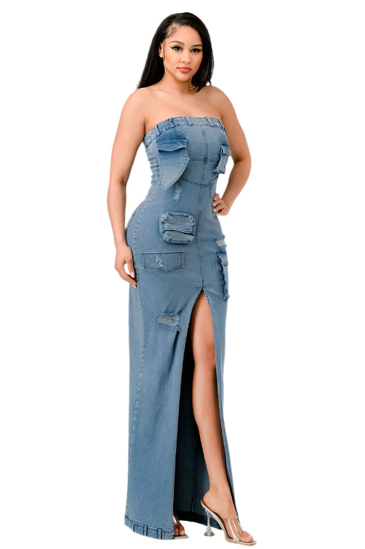 Where edgy streetwear meets evening elegance. This unique piece combines the casual appeal of denim with the sophistication of a formal gown. The garment boasts a strapless bodice with a straight-across neckline, highlighted by a playful ruffle that adds a touch of feminine flair.