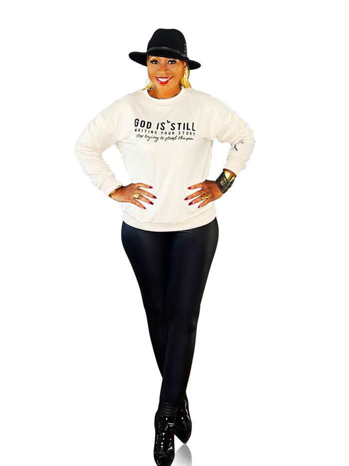 Lightweight sweater top featuring 'In Him We Trust' graphic – a cozy, faith-filled piece that inspires confidence and comfort in every wear.