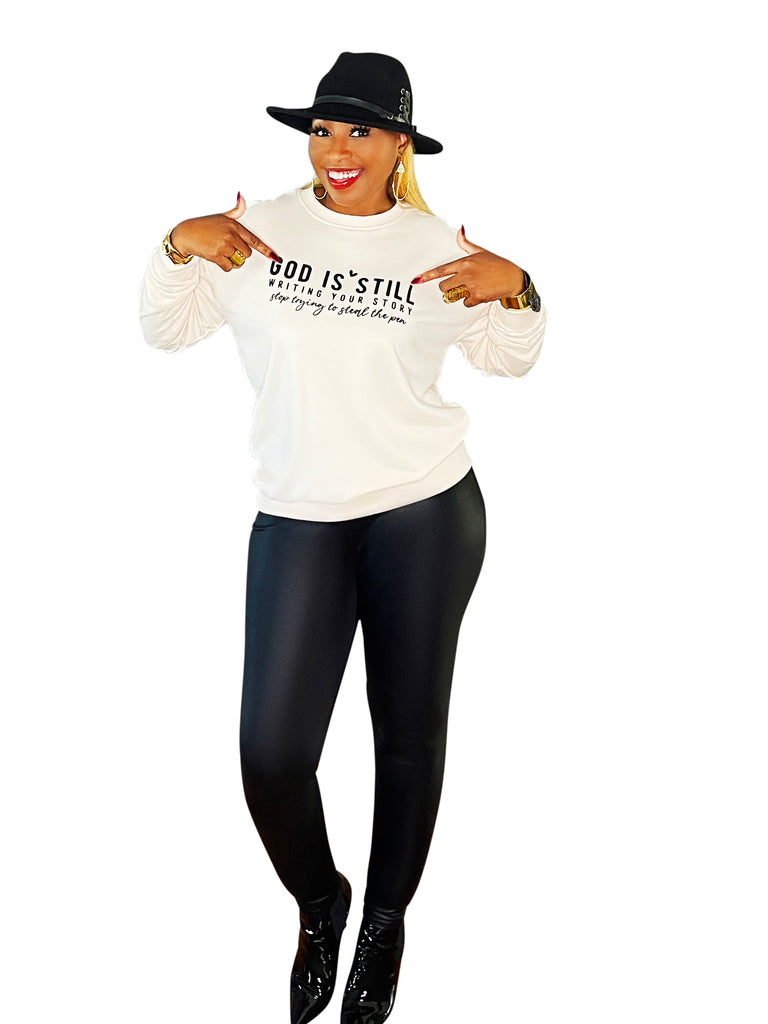 Lightweight sweater top featuring 'In Him We Trust' graphic – a cozy, faith-filled piece that inspires confidence and comfort in every wear.