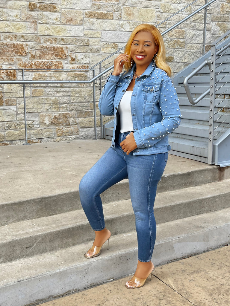 Medium wash denim jacket with pearl accents on front and sleeves, combining classic style with trendy, elegant details.
