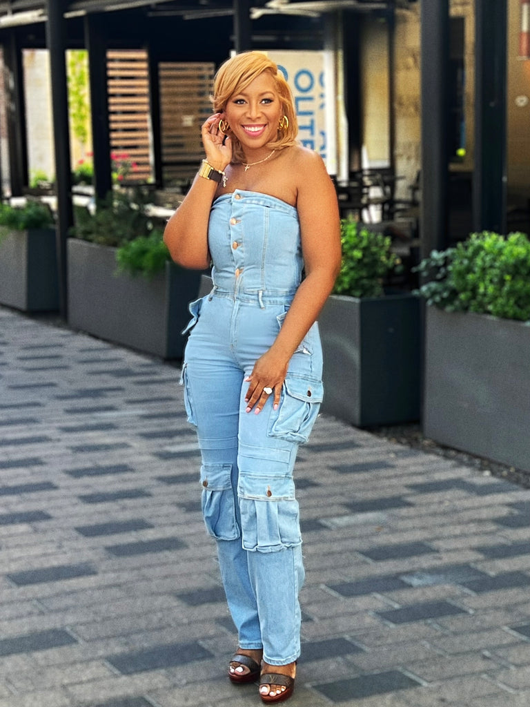 Strapless denim cargo jumpsuit with front pockets, button-up closure, and ultra-stretch fabric for a stylish, figure-hugging fit.