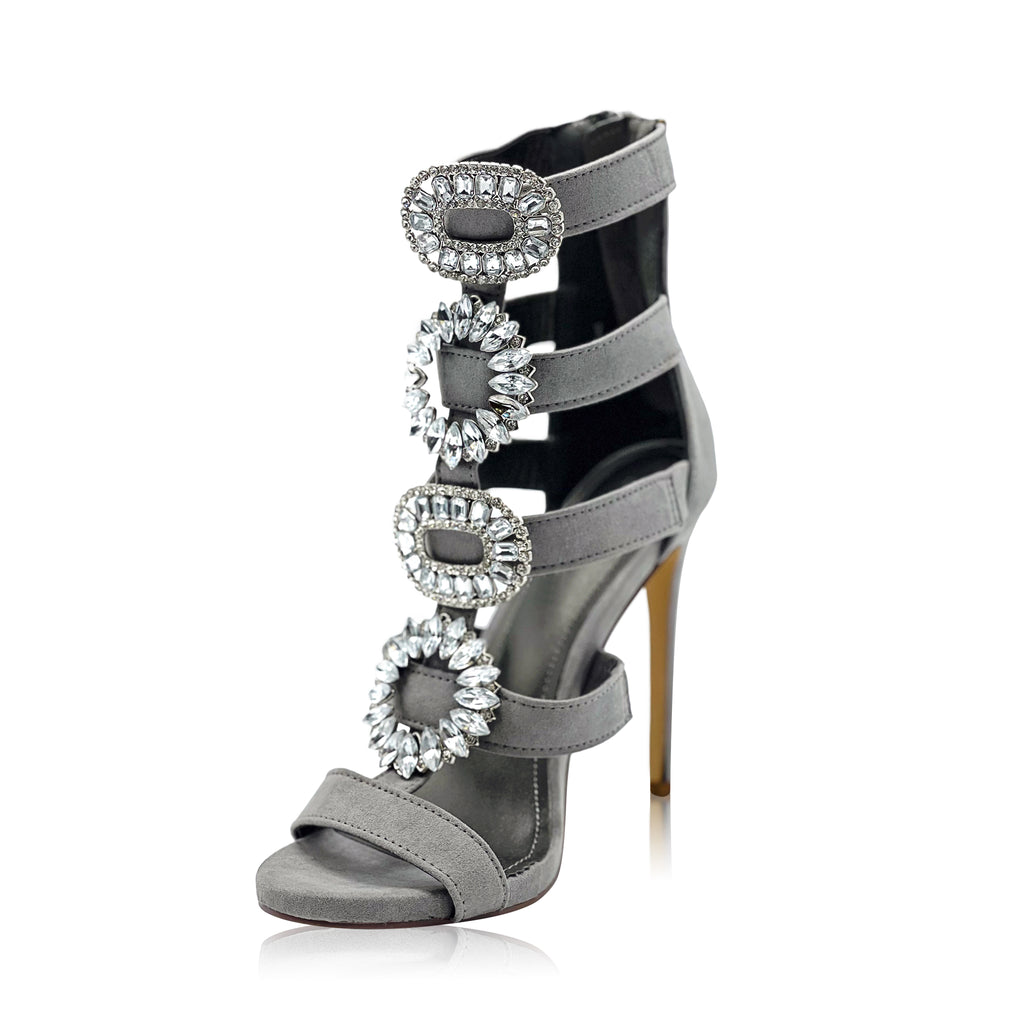 An elegant soft grey heel with rhinestone front accents and an open-toe style with a back zip closure complete this look. 