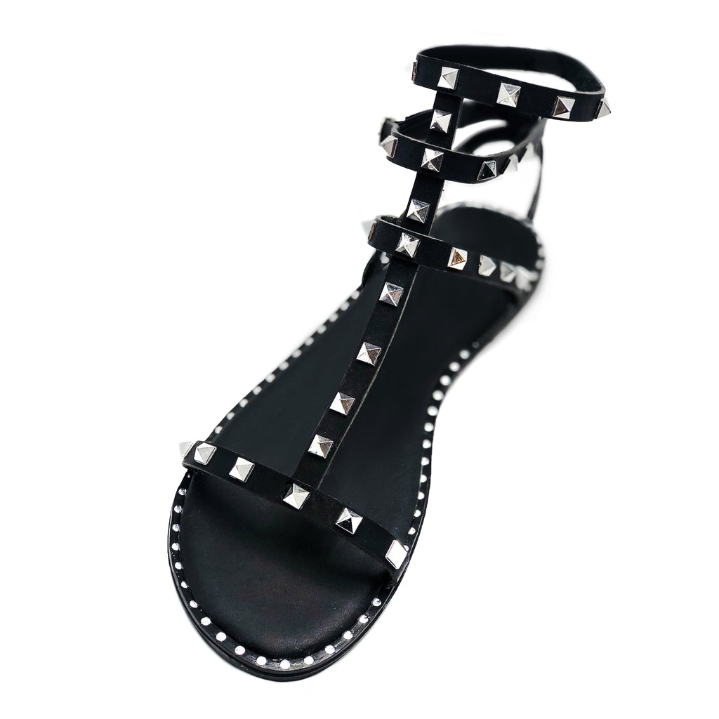 Gladiator sandals in black studded with an ankle strap closure 
