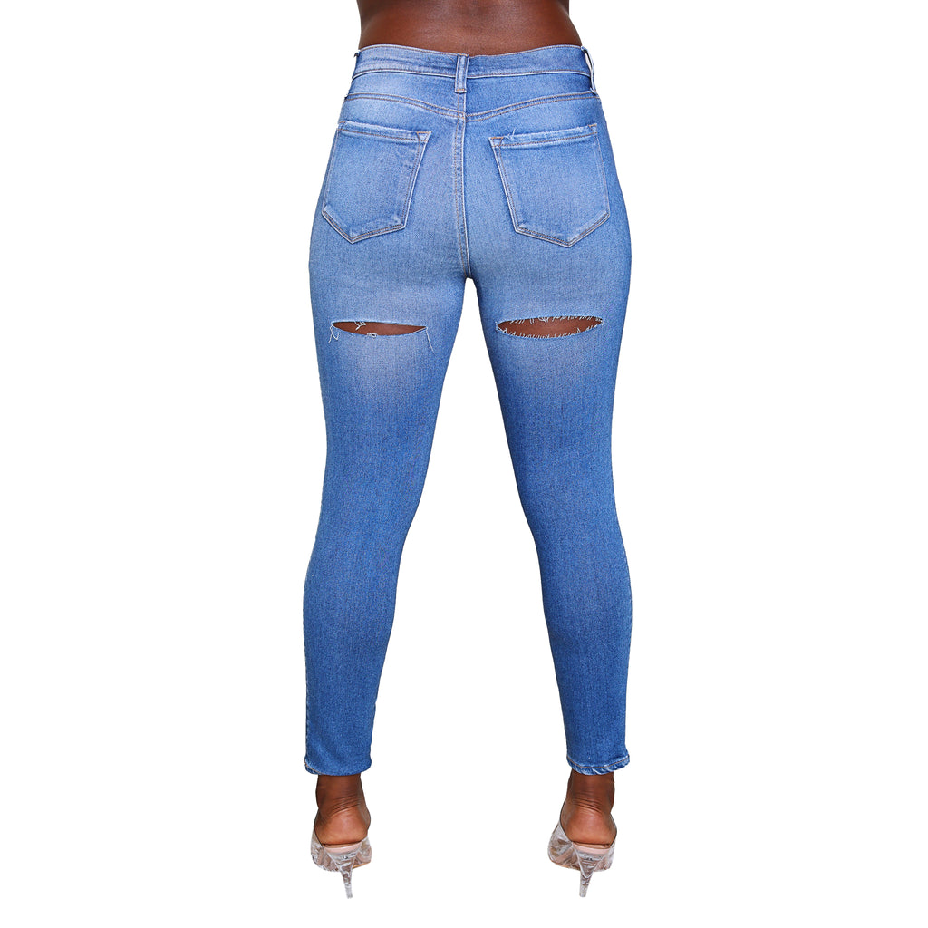 Solid blue, skinny jeans with functional front and back pockets.